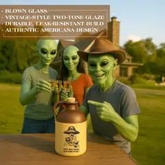 Group of green aliens enjoying drinks at an outdoor table with an alien-abduction moonshine jug, emphasizing blown glass, two-tone glaze, durability, and Americana styling.