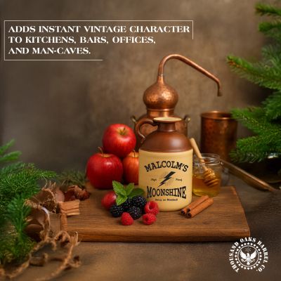 Vintage moonshine jug displayed with apples, berries, cinnamon, and a copper still, highlighting rustic kitchen and bar décor appeal.