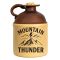 Mountain Thunder moonshine jug with vintage stoneware design, cork top, and mountain artwork on cream and brown ceramic